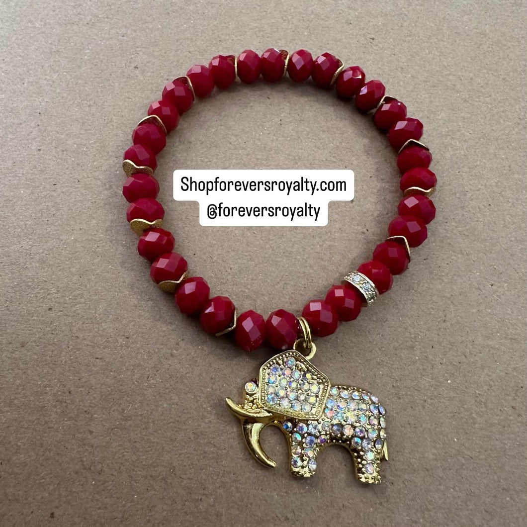 Red and gold elephant bracelet.