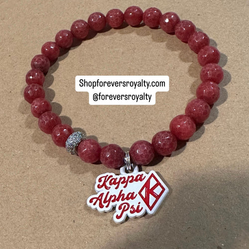 Red Kappa Alpha Psi bracelet.