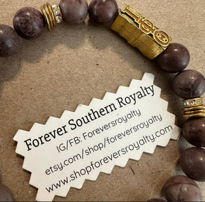 Brown and gold Iota bracelet .