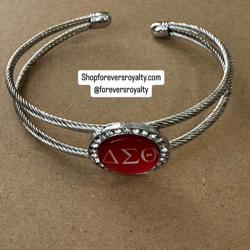 Red bangle cuff bracelet.