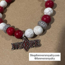 Load image into Gallery viewer, Red and tan Nupe bracelet.
