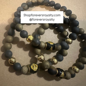 Black and gold A Phi A bracelet.