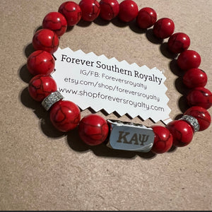 Red Kappa Alpha Psi bracelet.