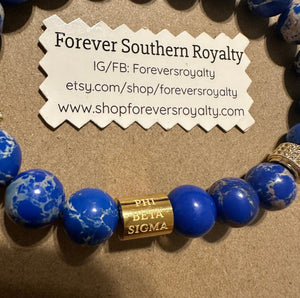 Gold Phi Beta Sigma bracelet.