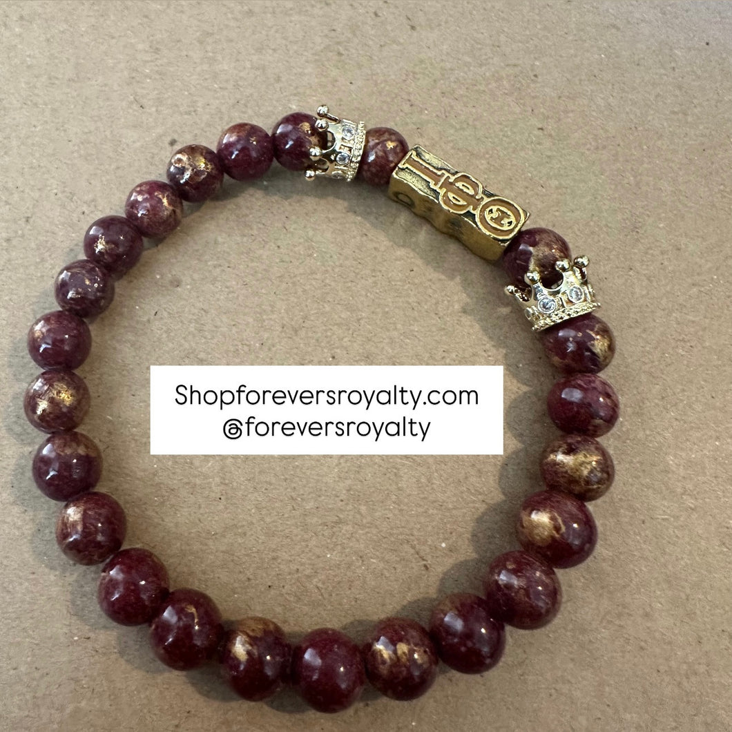 Brown and gold Iota Phi Theta bracelet.