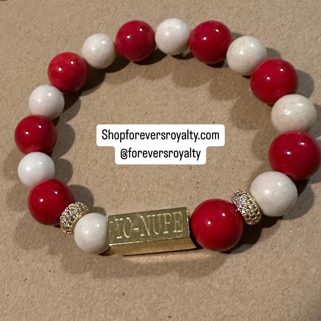 The gold YO Nupe bracelet.