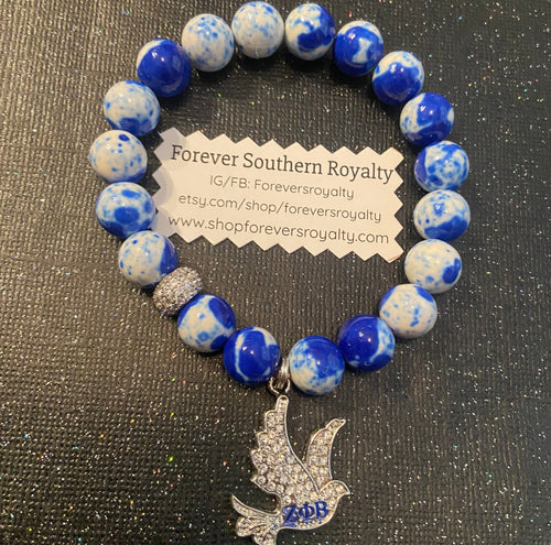 Blue and white Zeta Phi Beta dove bracelet.