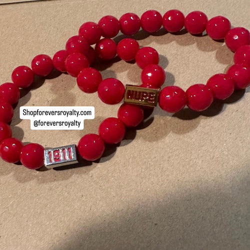 Red NUPE bracelet.