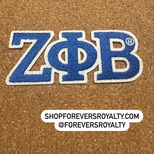 Blue and white Zeta Phi Beta patch.