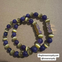 Load image into Gallery viewer, The purple and yellow Omega Psi Phi bracelet.