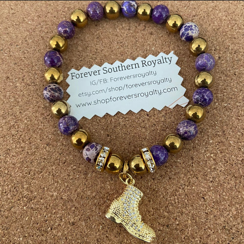 Omega purple and gold boot bracelet.