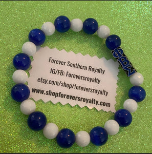 White and blue Sigma bracelet.