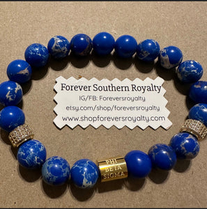 Gold Phi Beta Sigma bracelet.