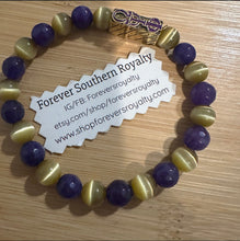 Load image into Gallery viewer, The purple and yellow Omega Psi Phi bracelet.