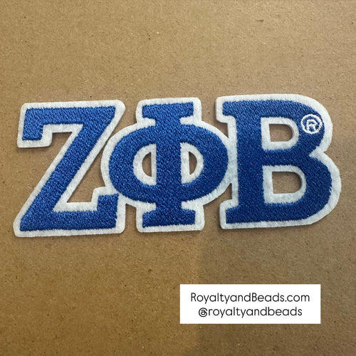 Blue and white Zeta Phi Beta patch.