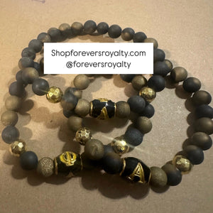 Black and gold A Phi A bracelet.