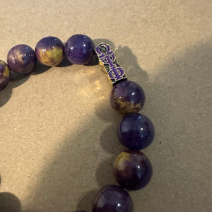 Purple Omega Psi Phi bracelet.