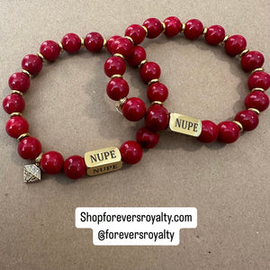 Red and gold NUPE bracelet.