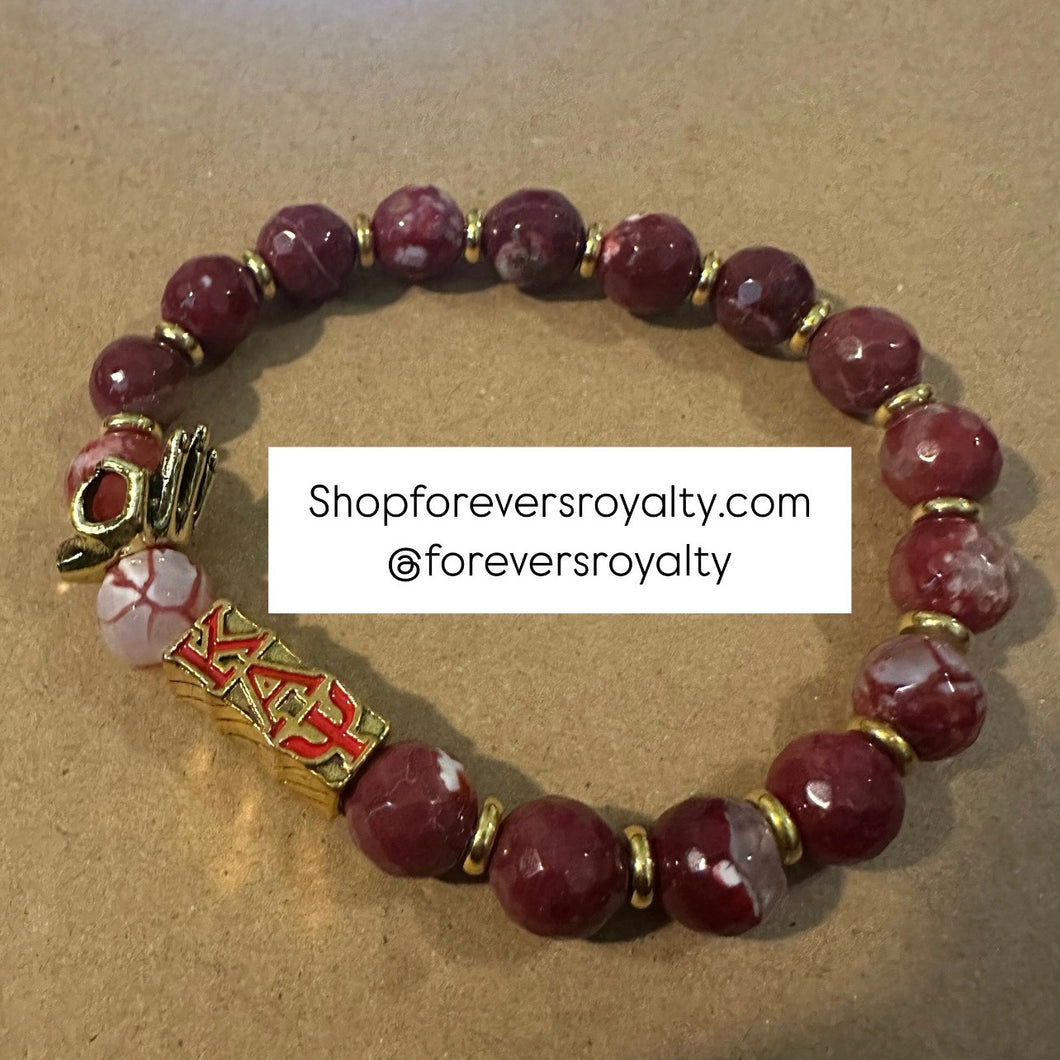 Red and gold Kappa Alpha Psi bracelet.