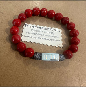 The Red NUPE bracelet.