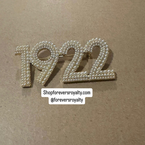 Gold pearl 1922 pin.