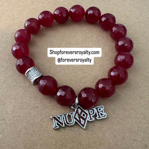 The red NUPE bracelet.