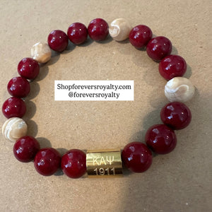 Red and gold Kappa Alpha Psi bracelet.