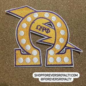 Yellow Omega Psi Phi patch.