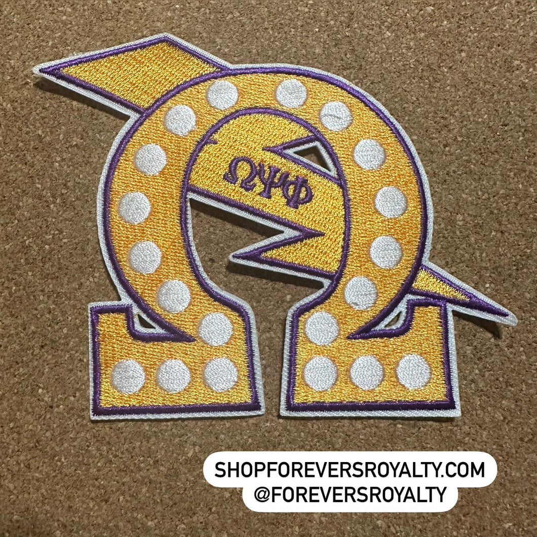 Yellow Omega Psi Phi patch.